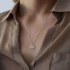 שרשרת כסף עם תליון 2 פיות אחת מול השניה בתוך מסגרת עיגול